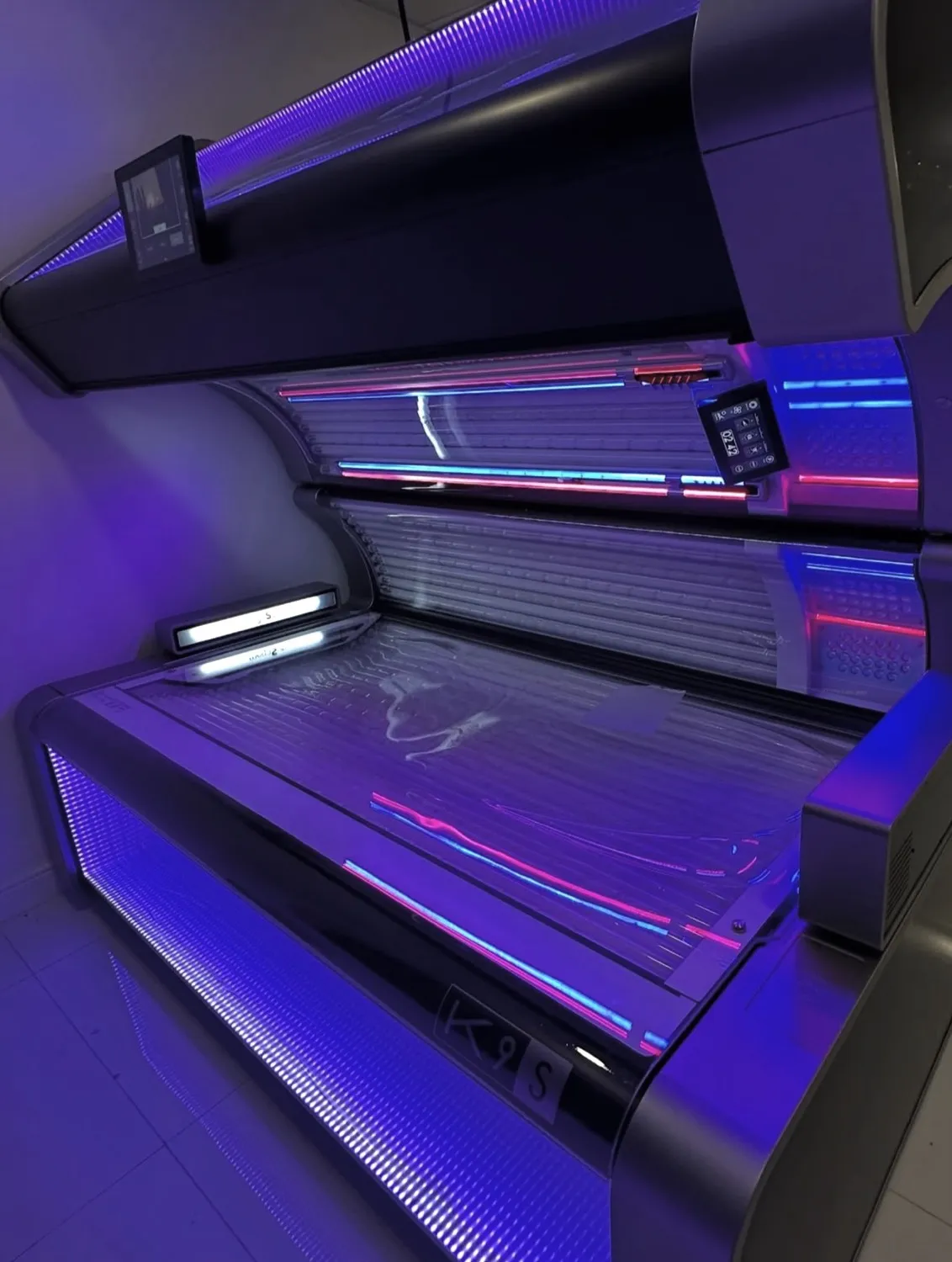 Lay down sunbed open and ready at Empire Tanning Lounge
